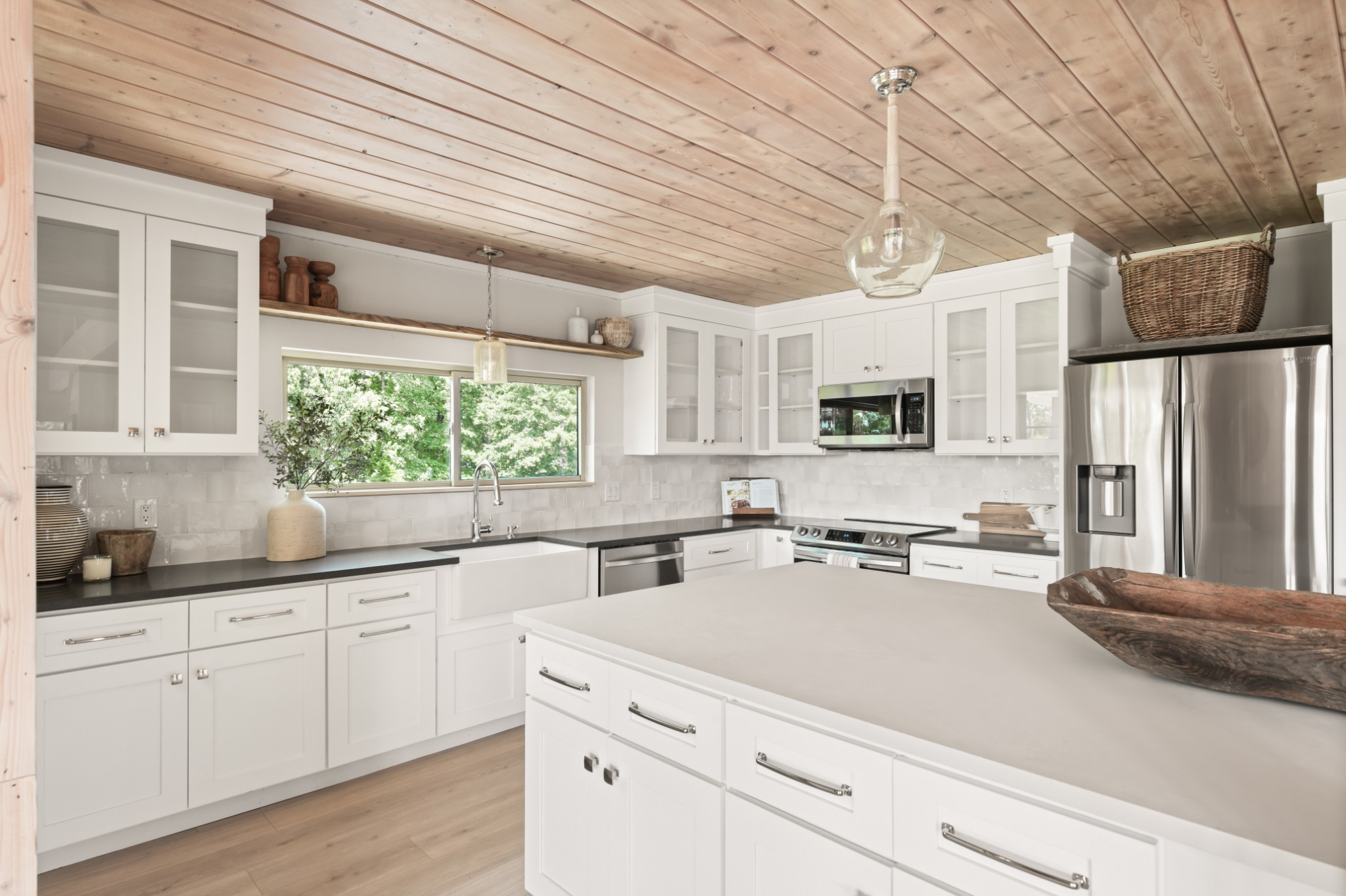 7720 Smith Road Primm Springs, TN 38476 - Photo 14 of 37 a kitchen with stainless steel appliances a sink a stove a refrigerator cabinets and a window