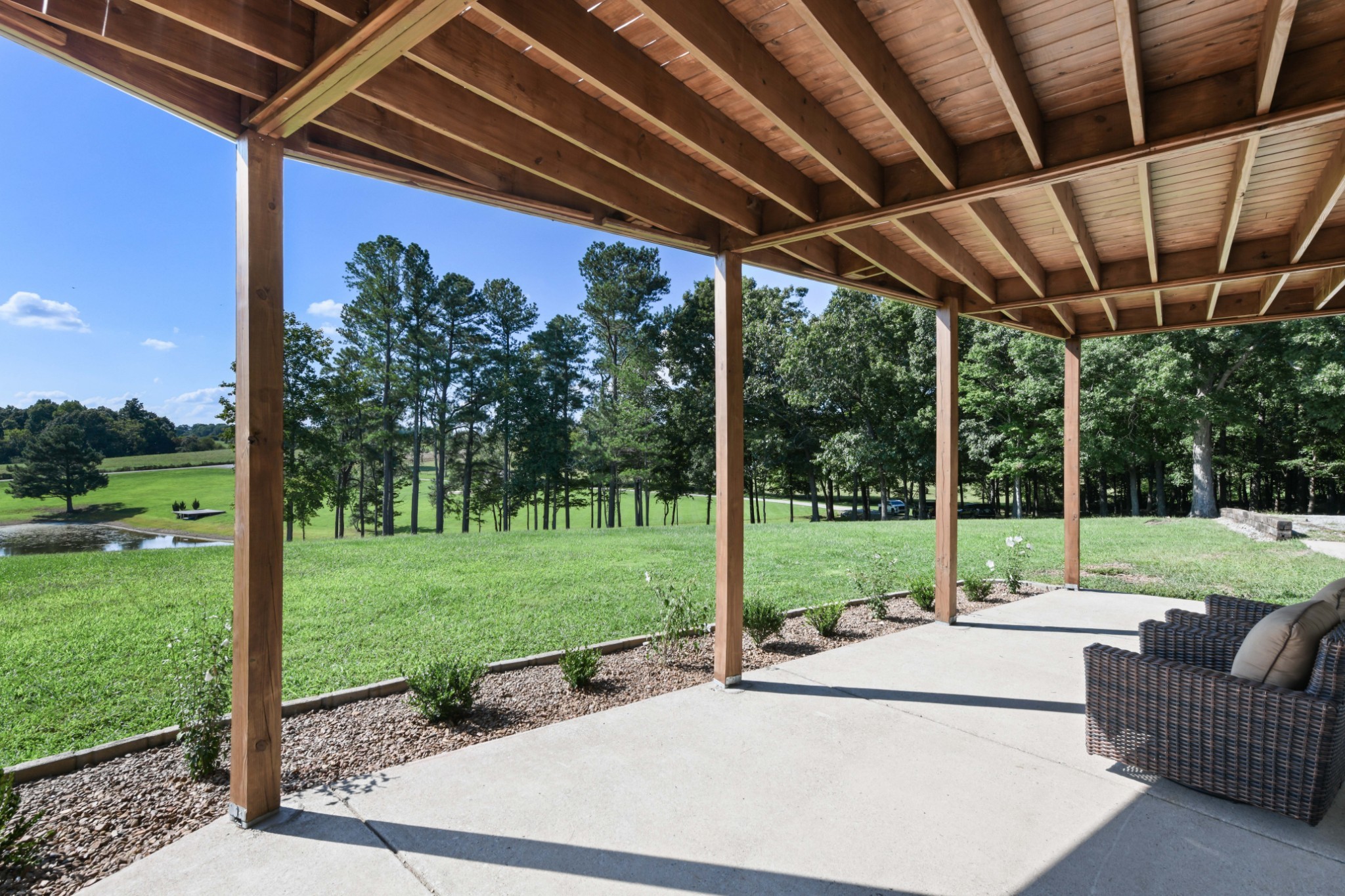 7720 Smith Road Primm Springs, TN 38476 - Photo 31 of 37 a view of a backyard with couches plants and tree