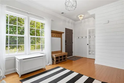 a bedroom with furniture and a window