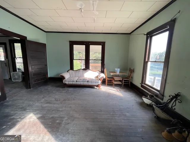 a bed room with a bed and a balcony