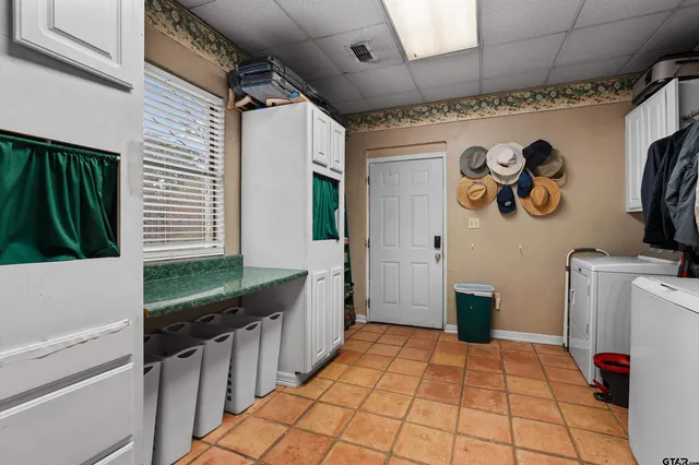 a bathroom with a sink a toilet and a shower