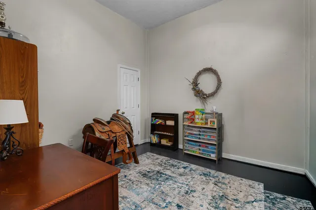 a view of a workspace with furniture