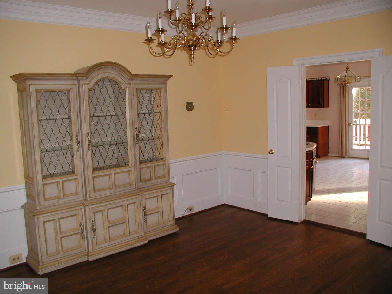 2206 Central Avenue Vienna, VA 22182 - Photo 13 of 20 a view of a hallway with wooden floor and cabinet