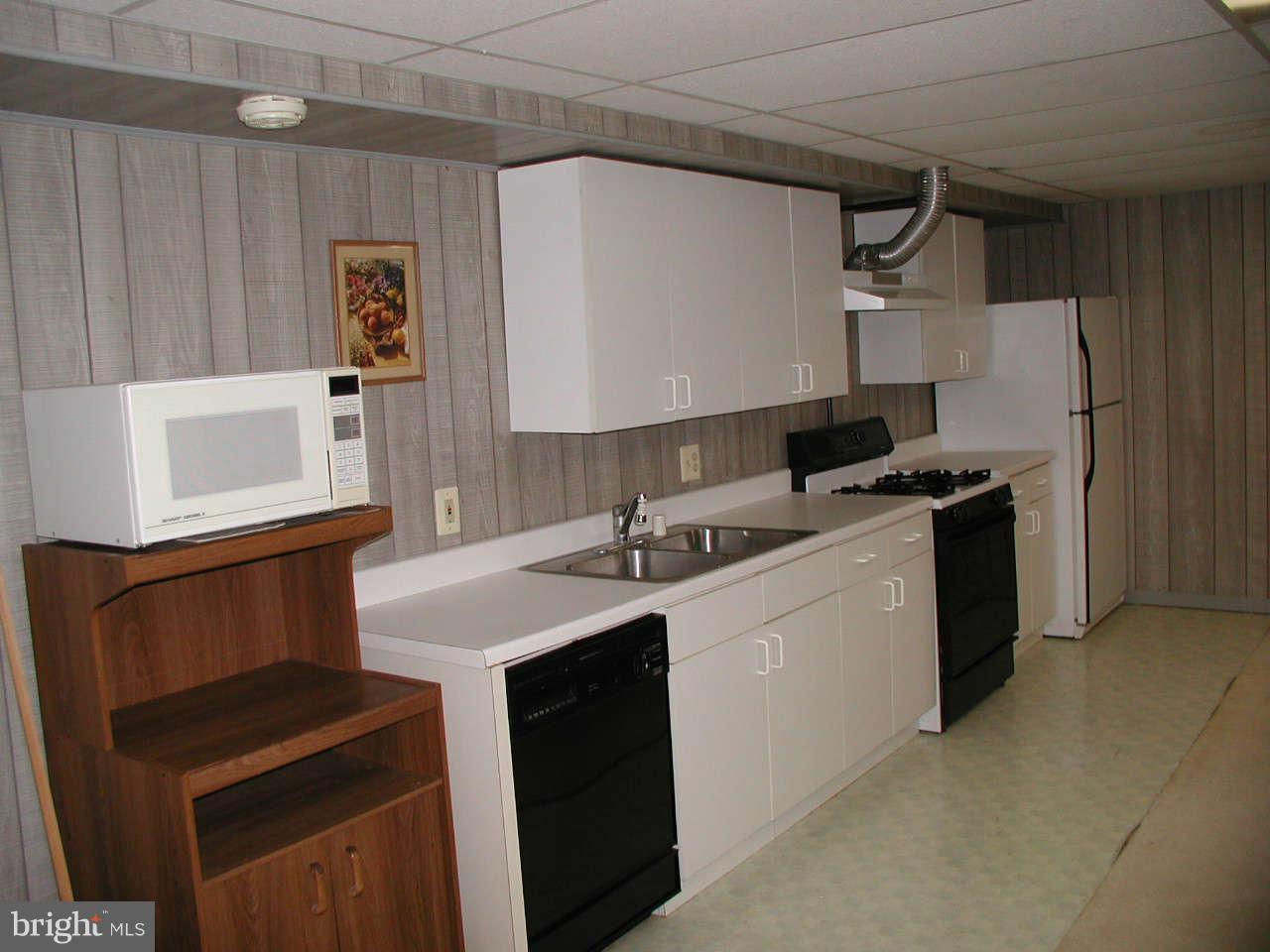 2206 Central Avenue Vienna, VA 22182 - Photo 18 of 20 a kitchen with stainless steel appliances a sink a stove a microwave a sink and cabinets