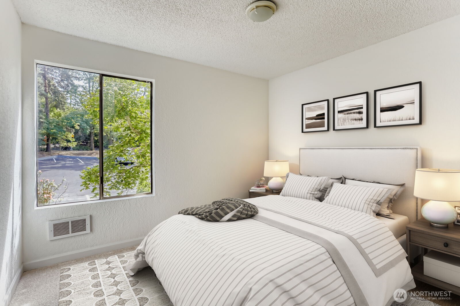 830 Kirkland Way, Unit 204 Kirkland, WA 98033 - Photo 18 of 27 a bedroom with a bed and a window