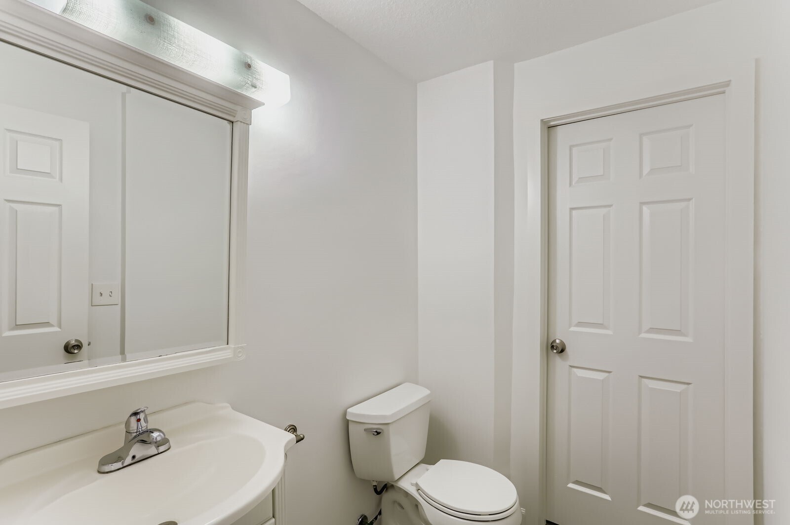 830 Kirkland Way, Unit 204 Kirkland, WA 98033 - Photo 20 of 27 a bathroom with a sink a toilet and shower