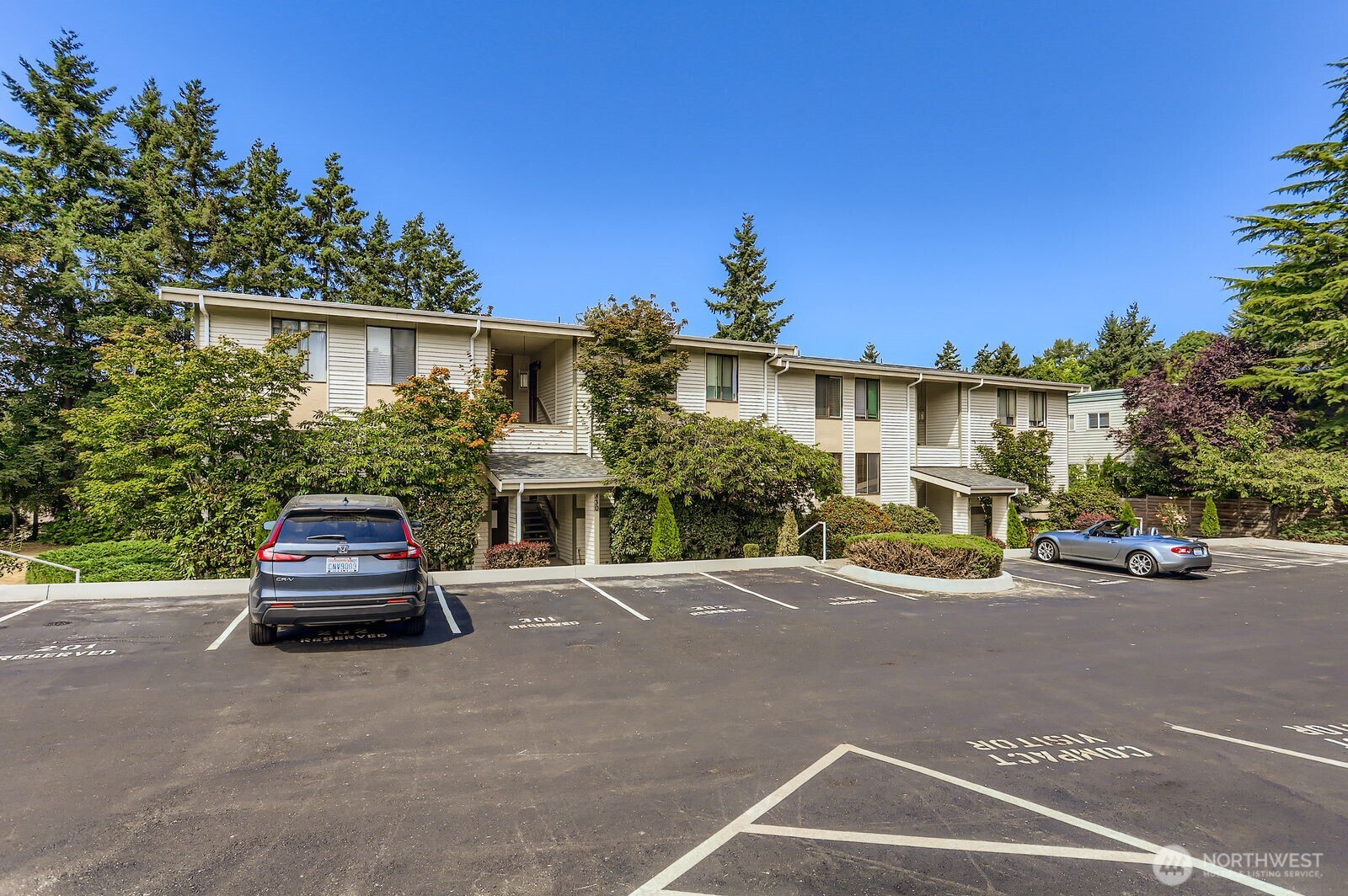 830 Kirkland Way, Unit 204 Kirkland, WA 98033 - Photo 26 of 27 a car parked in front of a house