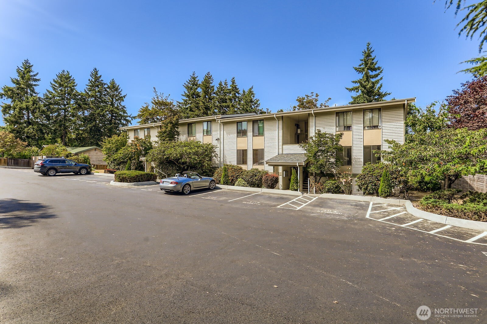 830 Kirkland Way, Unit 204 Kirkland, WA 98033 - Photo 27 of 27 a view of a street with a car parked in front of it