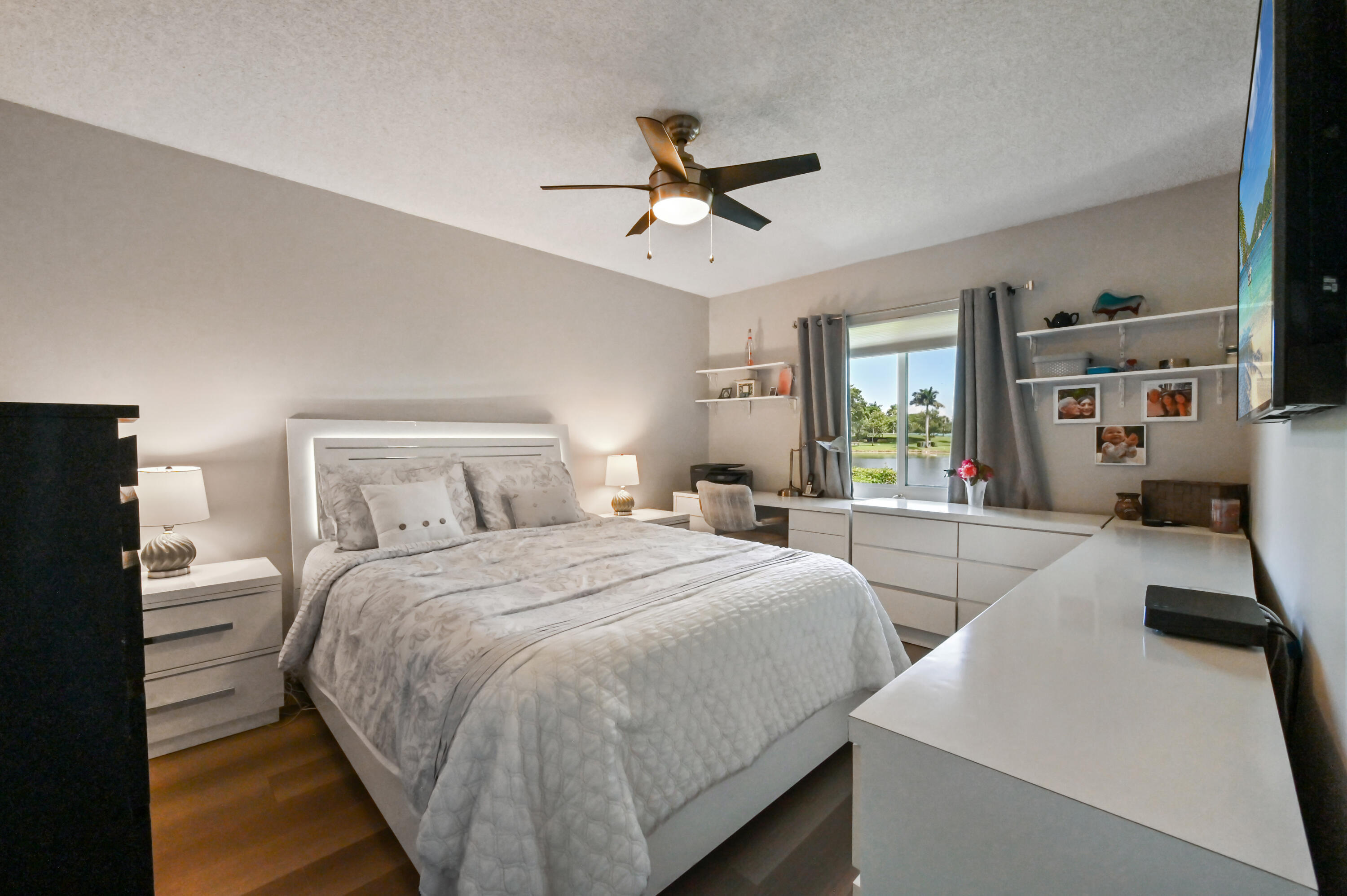 18824 Argosy Drive, Unit C Boca Raton, FL 33496 - Photo 13 of 18 a bedroom with two beds and a chandelier