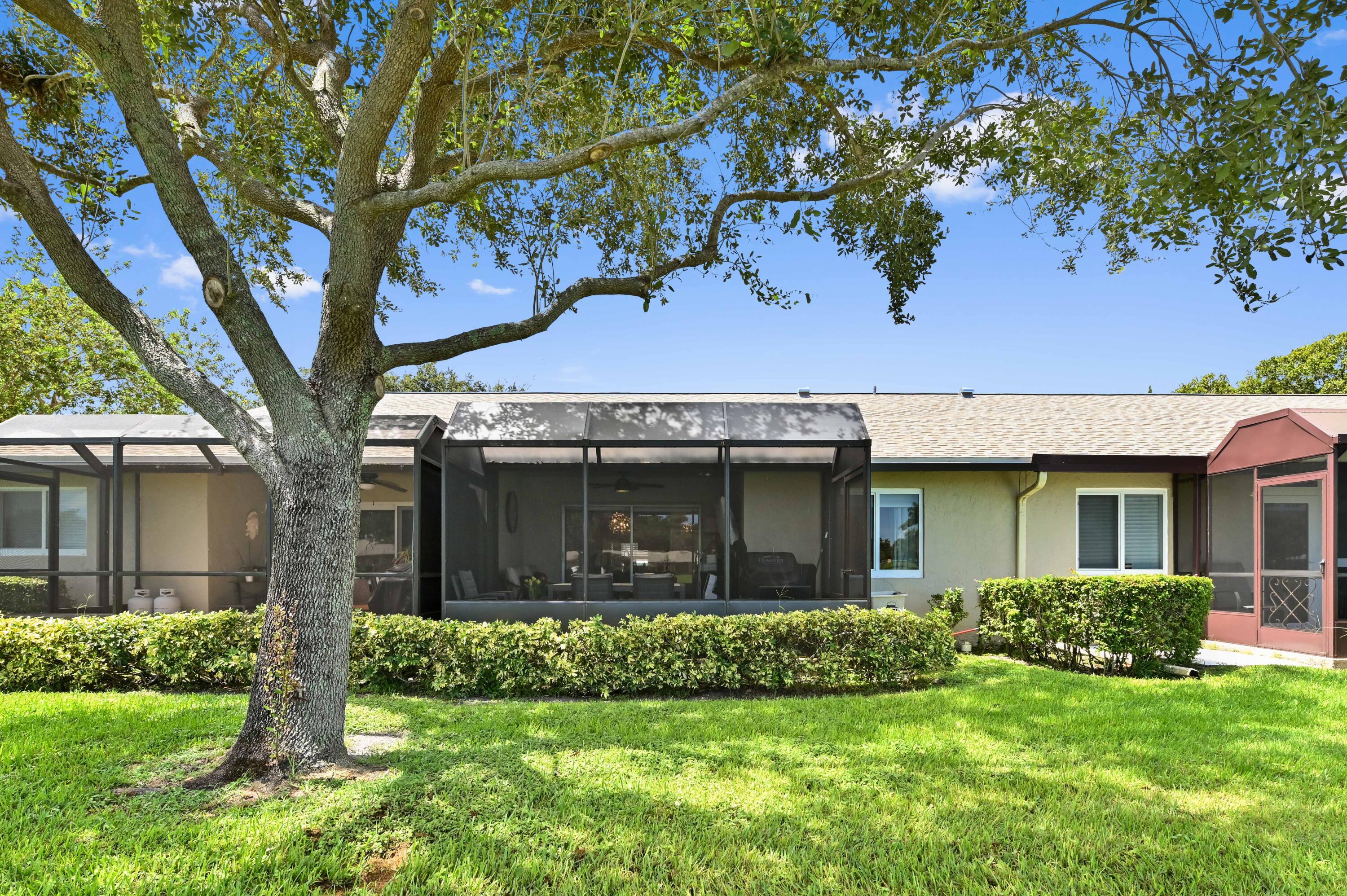 18824 Argosy Drive, Unit C Boca Raton, FL 33496 - Photo 18 of 18 a front view of a house with a yard