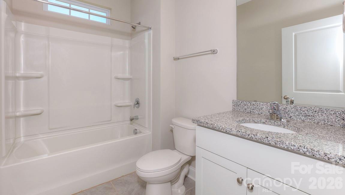 635 River Btm Road Fletcher, NC 28732 - Photo 13 of 31 a bathroom with a granite countertop sink toilet and shower