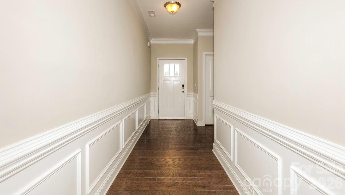 635 River Btm Road Fletcher, NC 28732 - Photo 9 of 31 a view of a hallway with wooden floor and a bathroom