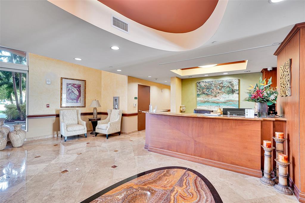 821 North Riverside Drive, Unit PH2 Pompano Beach, FL 33062 - Photo 12 of 95 a living room with furniture and a large window