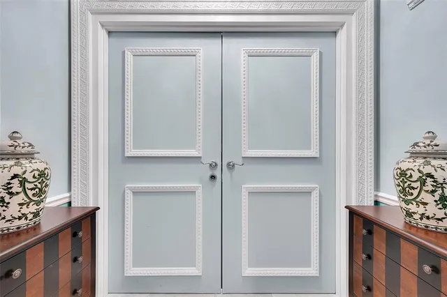 a spacious bedroom with a bed and a chair