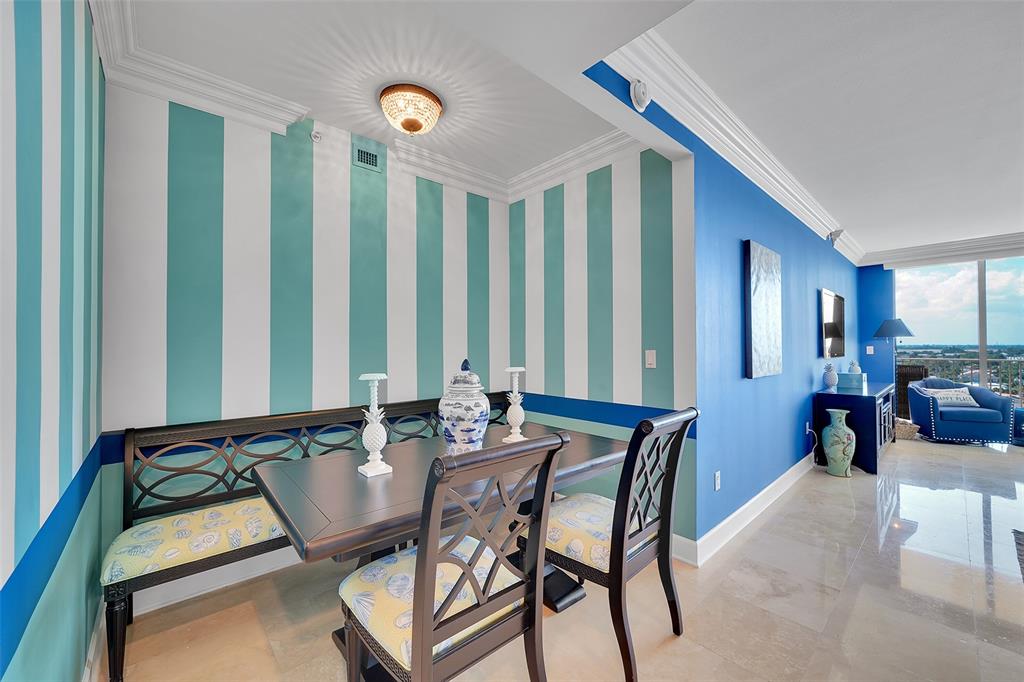 821 North Riverside Drive, Unit PH2 Pompano Beach, FL 33062 - Photo 22 of 95 a dining room with furniture and wooden floor