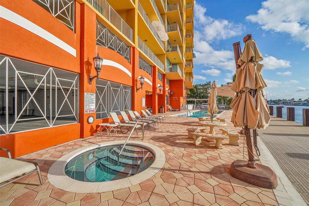 821 North Riverside Drive, Unit PH2 Pompano Beach, FL 33062 - Photo 81 of 95 a swimming pool with outdoor seating