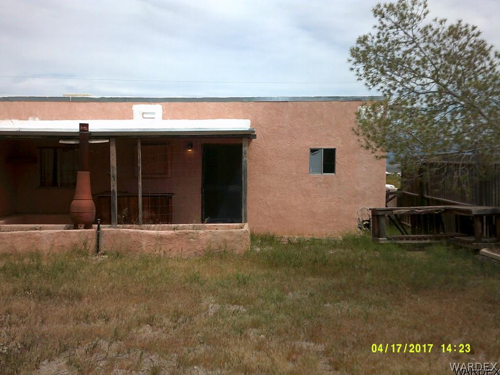 2373 South Dragoon Road Golden Valley, AZ 86413 - Photo 4 of 27 a view of a house with backyard space