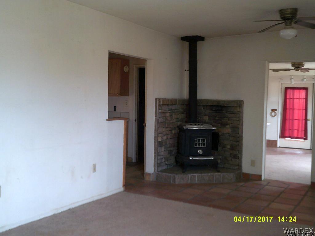 2373 South Dragoon Road Golden Valley, AZ 86413 - Photo 8 of 27 a living room with a fireplace
