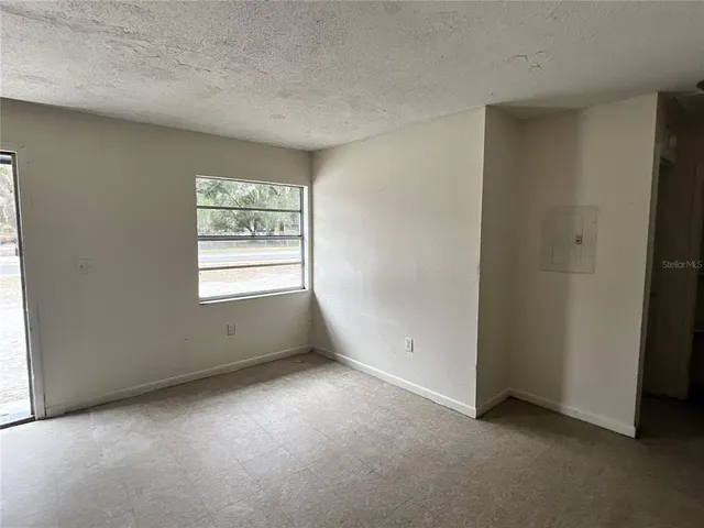 an empty room with windows