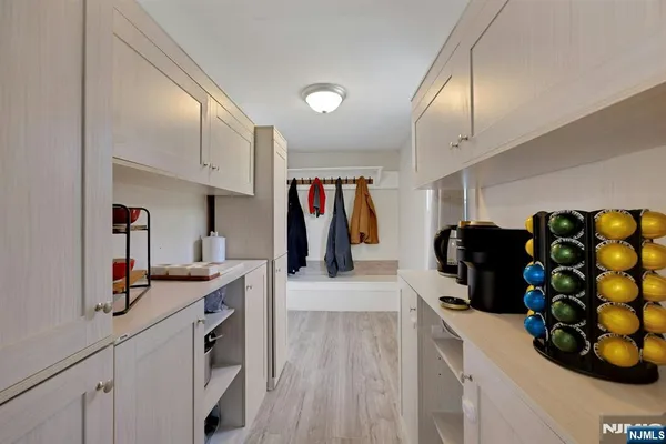 a kitchen with stainless steel appliances refrigerator and cabinets