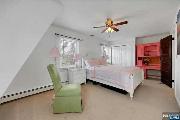 a bedroom with furniture and window