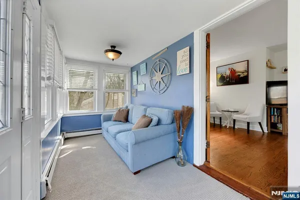 a living room with furniture and a window