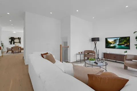 a living room with furniture and a table