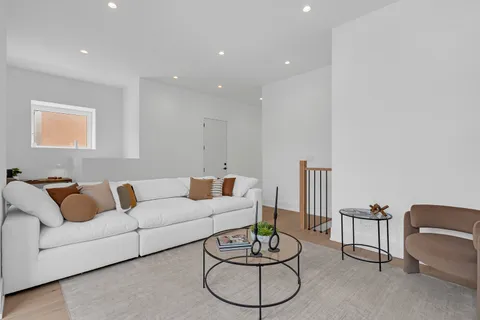 a bathroom with a sink a toilet a glass door a shower and a mirror