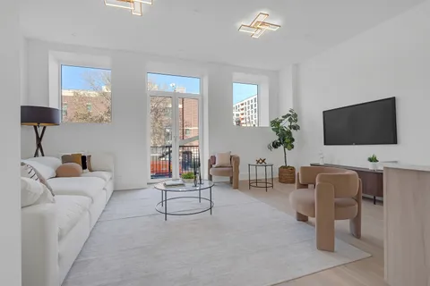 a bedroom with a bed and a night stand