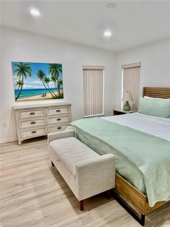 27579 Big Bend Road Bonita Springs, FL 34134 - Photo 4 of 9 a bedroom with a bed and painting on the wall