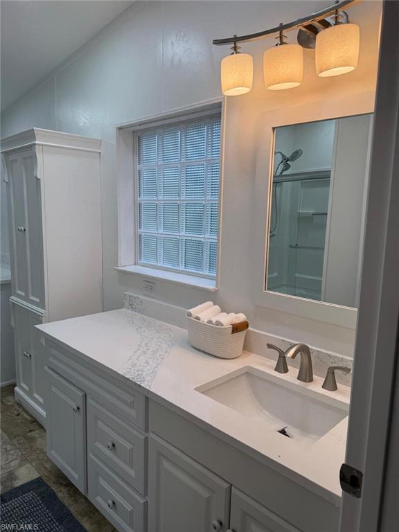 27579 Big Bend Road Bonita Springs, FL 34134 - Photo 6 of 9 a bathroom with a sink and a mirror