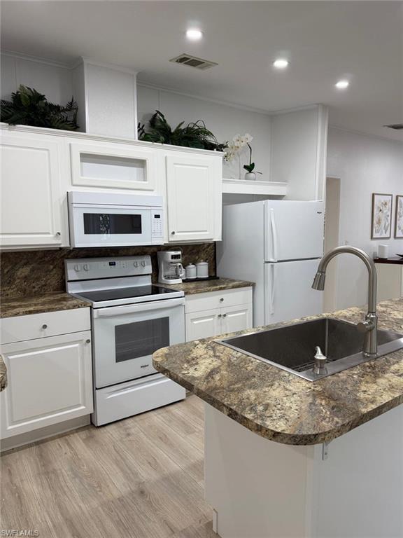 27579 Big Bend Road Bonita Springs, FL 34134 - Photo 7 of 9 a kitchen with stainless steel appliances granite countertop a sink stove and refrigerator