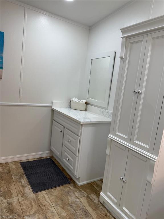 27579 Big Bend Road Bonita Springs, FL 34134 - Photo 9 of 9 a bathroom with a sink and a mirror