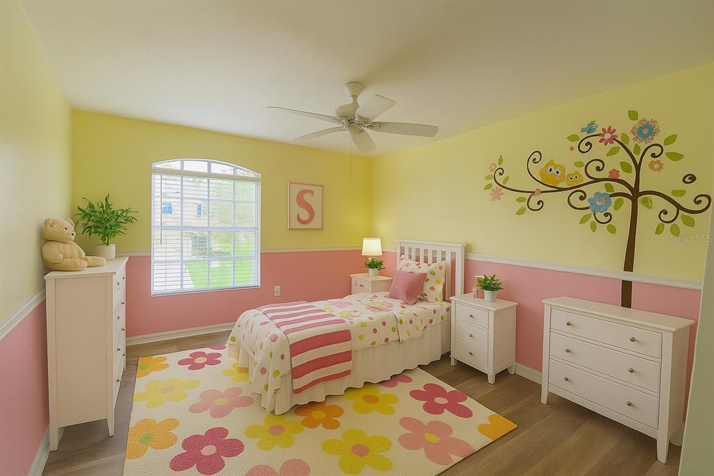 7018 Cascade Court Lakeland, FL 33813 - Photo 14 of 31 a bedroom with a bed and a window