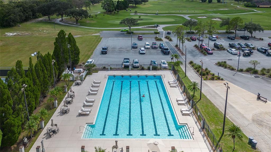 7018 Cascade Court Lakeland, FL 33813 - Photo 27 of 31 a view of a swimming pool with a yard