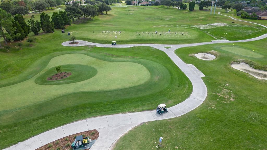7018 Cascade Court Lakeland, FL 33813 - Photo 28 of 31 a view of a golf course with a garden