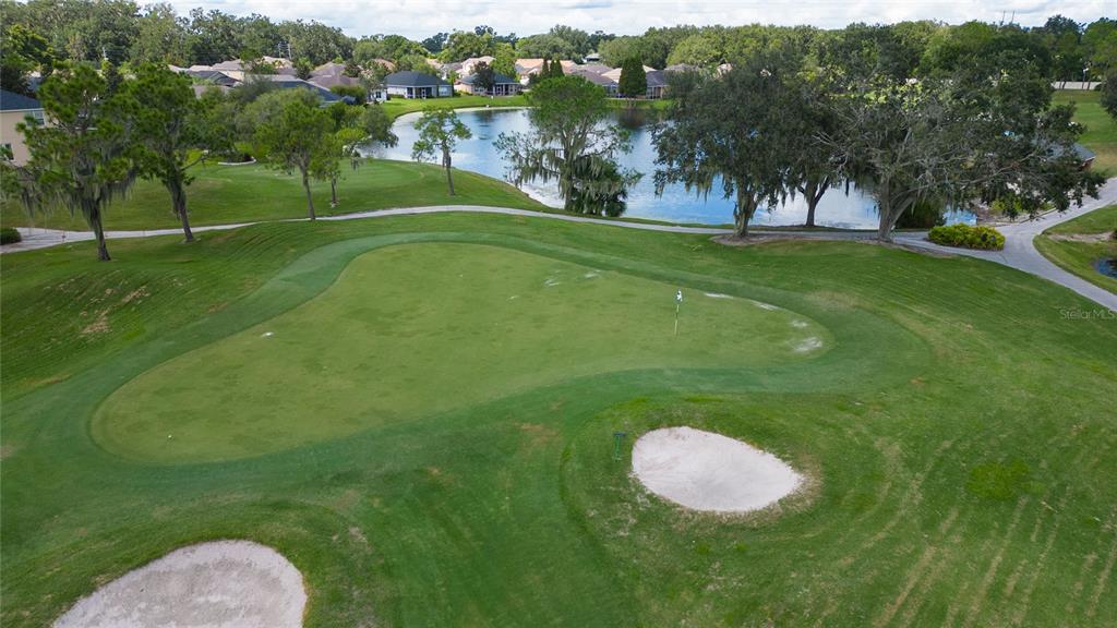 7018 Cascade Court Lakeland, FL 33813 - Photo 30 of 31 a view of a golf course with a fountain