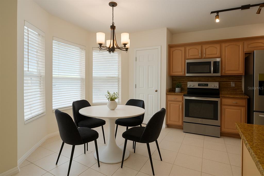 7018 Cascade Court Lakeland, FL 33813 - Photo 9 of 31 a view of a dining room with furniture and a chandelier
