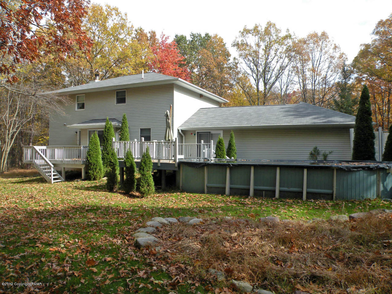 335 Pin Oak Road Stroudsburg, PA 18360 - Photo 18 of 21 a view of a house with a yard and large tree