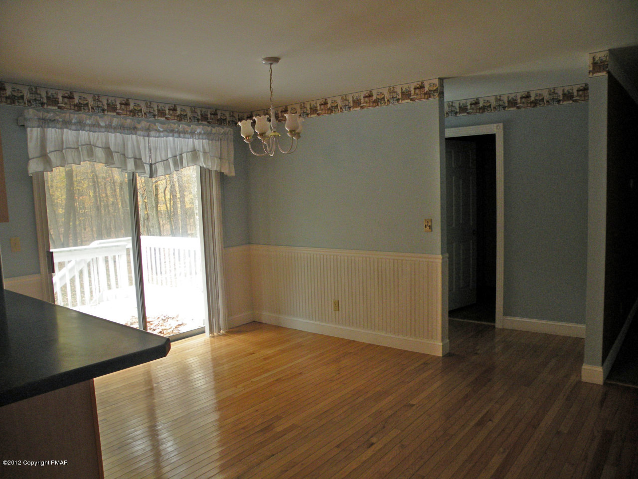 335 Pin Oak Road Stroudsburg, PA 18360 - Photo 4 of 21 wooden floor in an empty room with a window