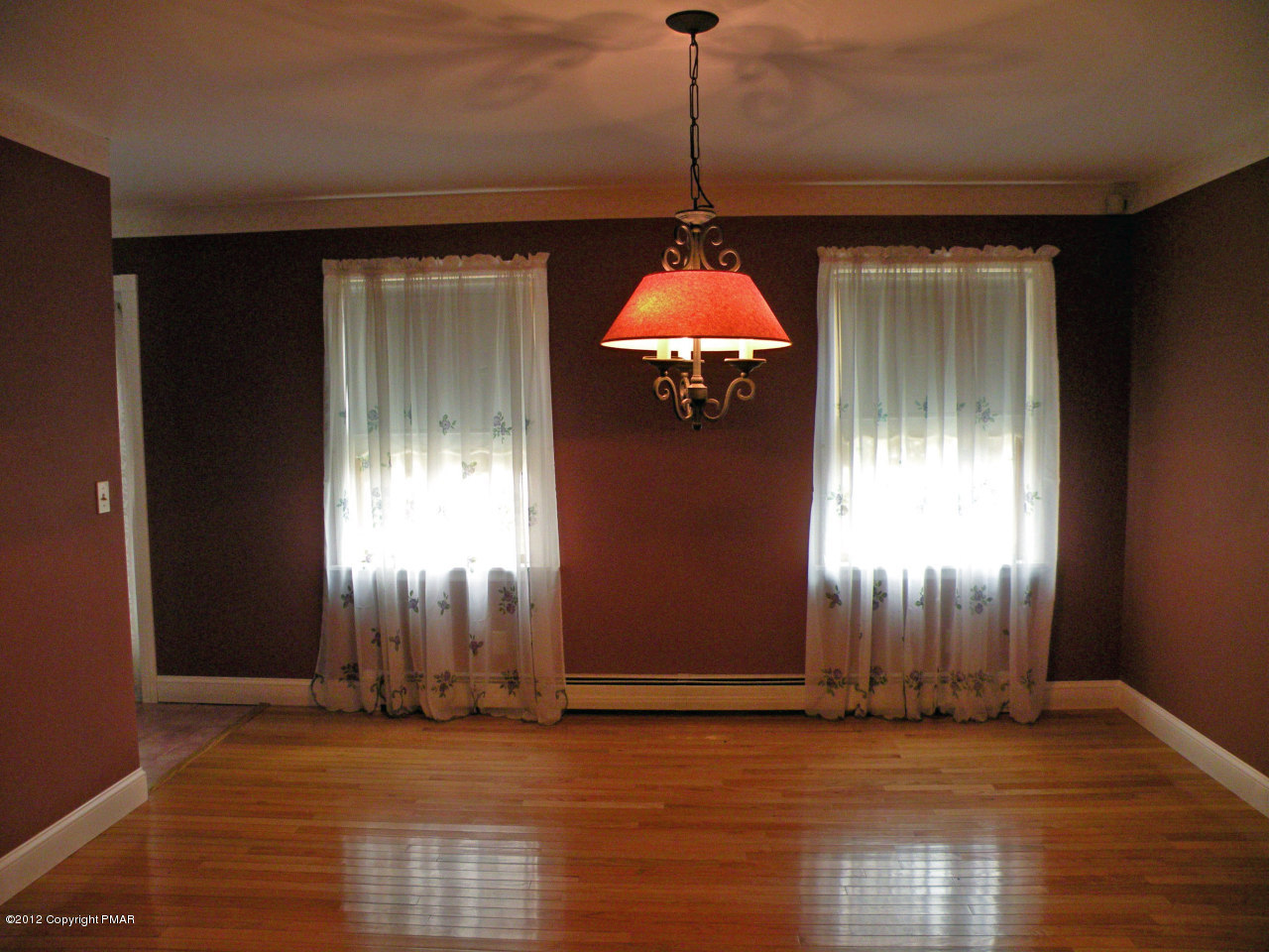 335 Pin Oak Road Stroudsburg, PA 18360 - Photo 8 of 21 a view of an empty room with window and wooden floor