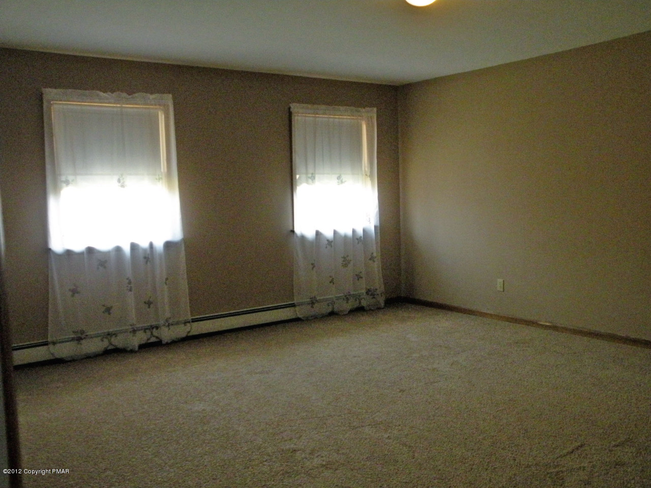 335 Pin Oak Road Stroudsburg, PA 18360 - Photo 9 of 21 an empty room with windows
