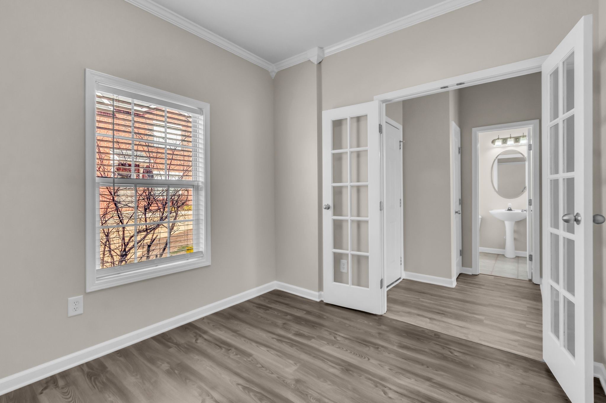 3008 Michael Lane Spring Hill, TN 37174 - Photo 12 of 33 a view of an empty room with wooden floor and a window