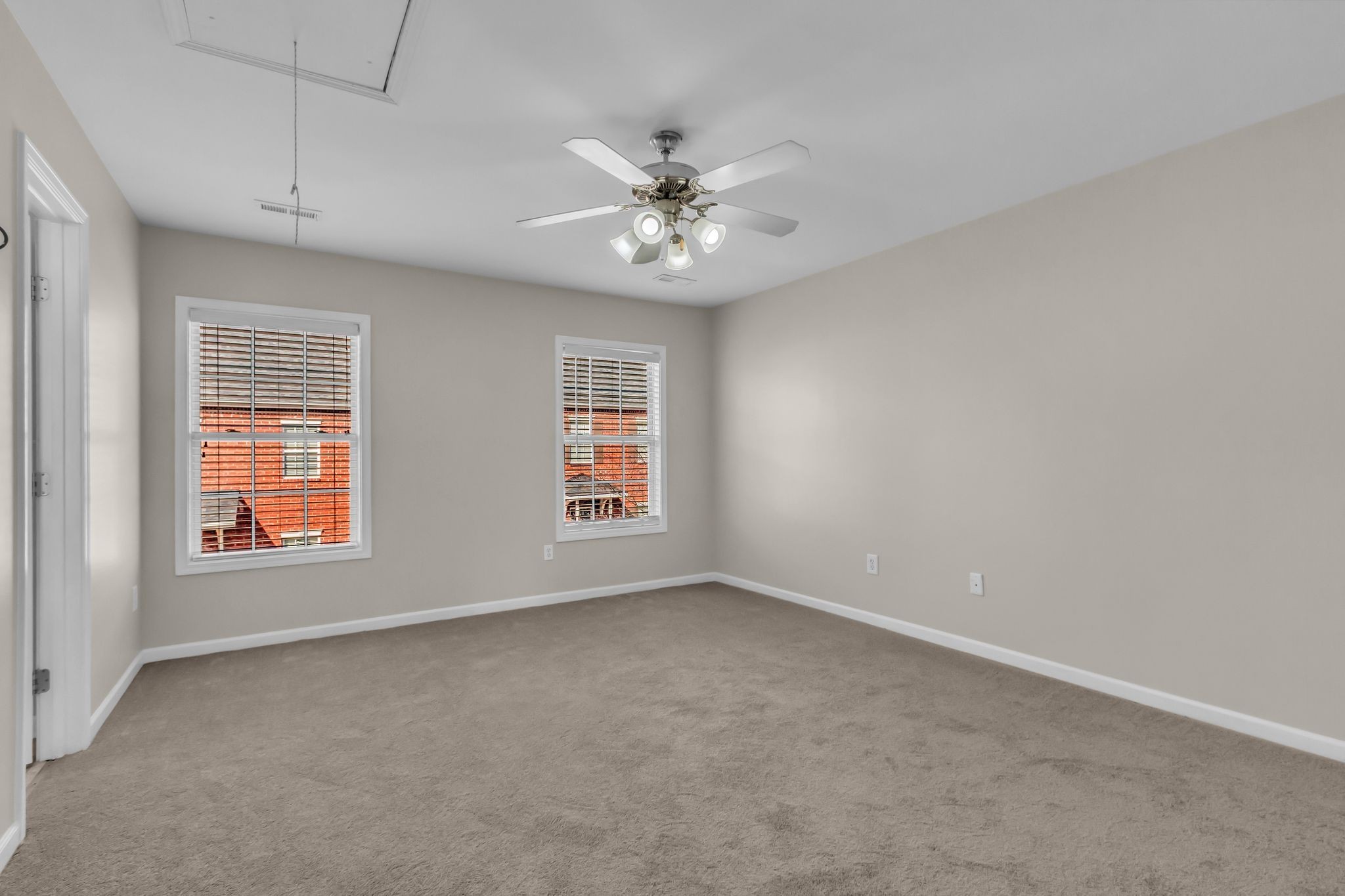 3008 Michael Lane Spring Hill, TN 37174 - Photo 16 of 33 an empty room with windows and chandelier fan