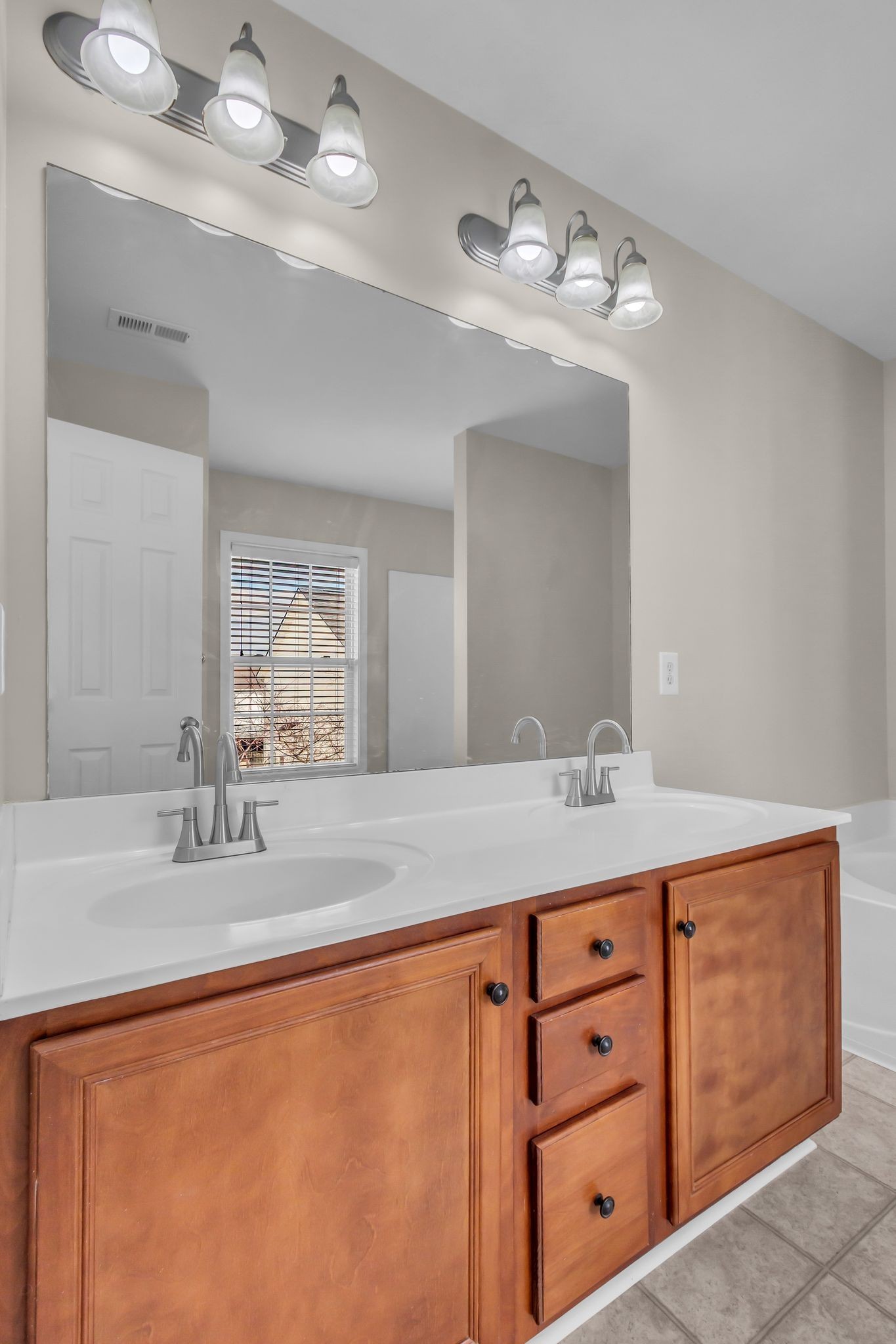 3008 Michael Lane Spring Hill, TN 37174 - Photo 19 of 33 a bathroom with a sink double vanity and a mirror