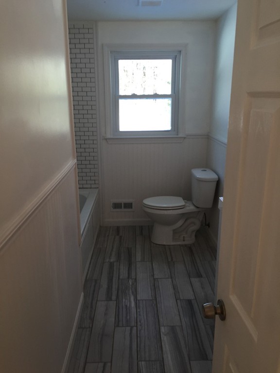 22 Winsor Road Billerica, MA 01821 - Photo 5 of 9 a bathroom with a toilet and a vanity