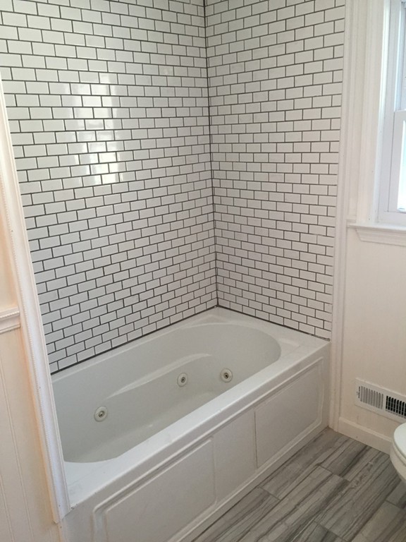 22 Winsor Road Billerica, MA 01821 - Photo 6 of 9 a bathroom with a bathtub