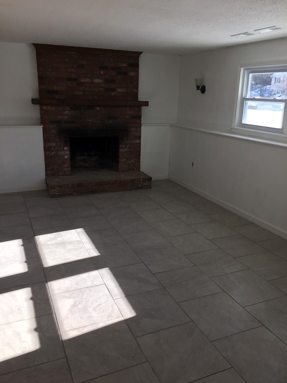 22 Winsor Road Billerica, MA 01821 - Photo 8 of 9 an empty room with windows
