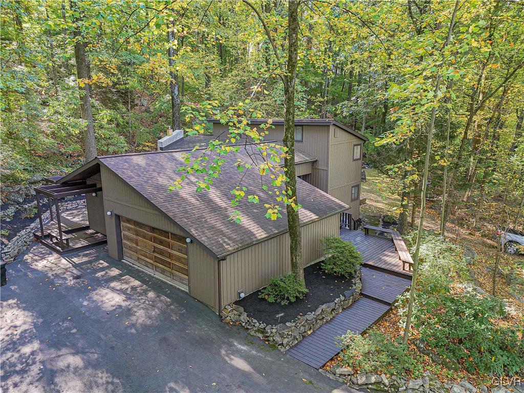 110 Mountain Park Road Allentown, PA 18103 - Photo 1 of 22 a view of a wooden wall with trees in front of it