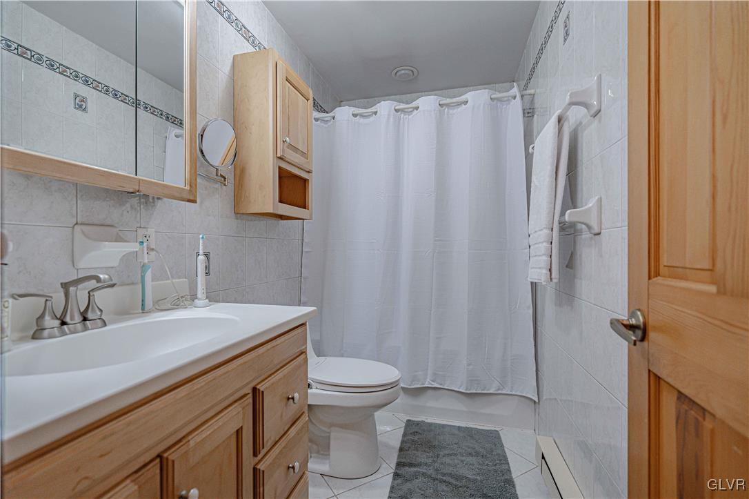 110 Mountain Park Road Allentown, PA 18103 - Photo 14 of 22 a bathroom with a sink a toilet and shower